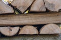 Chopped logs of firewood are stacked in a pile.Concept: harvesting firewood for the winter, the beginning of the heating season, e Royalty Free Stock Photo