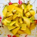 Chopped mango on a plate. Delicious tropical fruit