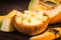 Chopped melon in a wooden bowl close Royalty Free Stock Photo