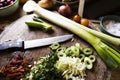 Chopped onions and herbs on a cutting board