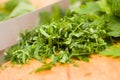 Chopped parsley on wooden cutting board