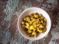 Chopped pickled cucumbers in a deep white plate for making salad Royalty Free Stock Photo