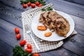 A large piece of baked meat Still life on a light wooden table Royalty Free Stock Photo