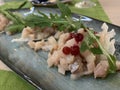 Chopped pieces of salmon fish - a type of muksun (freshwater), northern fish serving on a large platter.