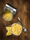 Chopped Pineapple preserved on wooden background; selective fo