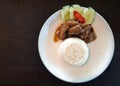 Chopped pork ribs fried with garlic gravy served with rice Royalty Free Stock Photo