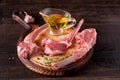 Chopped rack of lamb on a cutting board with a cup with olive oil. Meat menu, barbecue ingredients