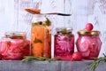 Chopped radish, carrot and red onion marinated in glass jars Royalty Free Stock Photo