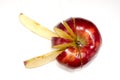 Chopped red apple on white surface Royalty Free Stock Photo