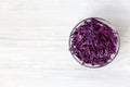 Chopped red cabbage in a bowl, close-up. Top view, from above, overhead.