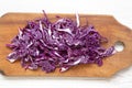 Chopped red cabbage on cutting board, closeup. Top view, overhead Royalty Free Stock Photo