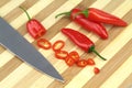 Chopped red hot chili peppers on bamboo kitchen board