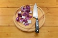 Chopped red onion with a knife on a chopping board Royalty Free Stock Photo