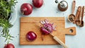 Chopped red onions on wooden cutting board Royalty Free Stock Photo