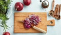 Chopped red onions on wooden cutting board Royalty Free Stock Photo