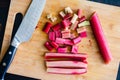 Chopped Rhubarb Stalks on a Bamboo Cutting Board