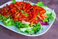 Chopped salad with peppers, lettuce and tomatoes