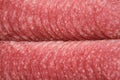 Chopped salami sausage, top view, flat lay Royalty Free Stock Photo