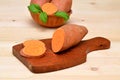 Chopped slices of sweet potato on the kitchen table Royalty Free Stock Photo