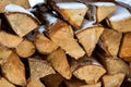 Chopped stock of firewood under snow on the street. Texture Royalty Free Stock Photo