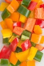 Chopped red, yellow, and green sweet peppers.