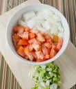 Chopped Tomatoes, Onions and Scallion on Cutting Board Royalty Free Stock Photo