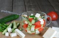 Chopped vegetables for the salad ingredients and spoon Royalty Free Stock Photo