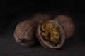 Chopped walnut on a dark background.