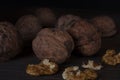 Chopped walnut on a dark background.
