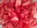 Chopped watermelon fruit cubes. Horizontal close up