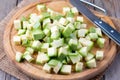 Chopped zucchini on wooden board Royalty Free Stock Photo