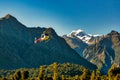 Chopper lifting off the ground on the West Coast of New Zealand