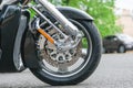 Chopper motorcycle wheel close up. Brake disc on a wheel from a motorcycle close up. Royalty Free Stock Photo