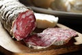 Chopping board with sliced salami Royalty Free Stock Photo