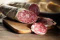Chopping board with sliced salami Royalty Free Stock Photo