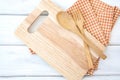 Chopping board and tablecloth with wooden fork and spoon on white table , a recipes food for healthy habits shot note background Royalty Free Stock Photo
