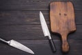 chopping board with two knives placed on an old wooden floor In the kitchen or in the restaurant used by the chef to cut Royalty Free Stock Photo