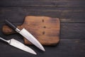 chopping board with two knives placed on an old wooden floor In the kitchen or in the restaurant used by the chef to cut Royalty Free Stock Photo