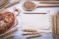 Chopping board wheat-rye ears sweet baked roll wooden spoon grai