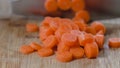 Chopping carrot on  a wooden chopping board Royalty Free Stock Photo