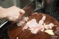 Chopping chicken on wooden chop board Royalty Free Stock Photo