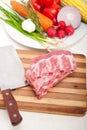 Chopping fresh pork ribs and vegetables Royalty Free Stock Photo