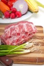 Chopping fresh pork ribs and vegetables Royalty Free Stock Photo