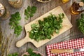 Chopping fresh tetterwort or greater celandine plant to prepare herbal tincture Royalty Free Stock Photo