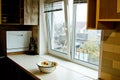 A chopping table with a set of knives in the kitchen against the background of the window. clean workplace for cooking food.