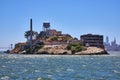 Choppy waters with close view of Alcatraz Island and distant Golden Gate Bridge and city skyscrapers