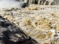 The choppy waters of the Yellow river with eroded rocks