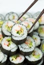 Chops picking up Single California Roll Royalty Free Stock Photo