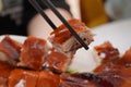 Chopstick Holding Suckling Pig Royalty Free Stock Photo