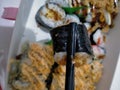 chopstick sushi wrapped in seaweed